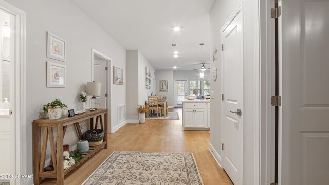 113 Mosaic Dr, Port St Joe, FL 32456 - corridor with light wood-type flooring, recessed lighting, and baseboards
