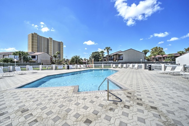 17614 Front Beach Rd Unit 17E, Panama City Beach, FL 32413 - community pool featuring a patio area