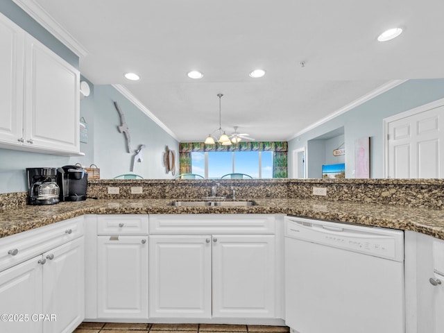 9450 S Thomas Dr Unit 1211, Panama City, FL 32408 - kitchen featuring dishwasher, a sink, ornamental molding, white cabinetry, and dark stone countertops