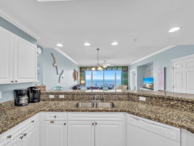 9450 S Thomas Dr Unit 1211, Panama City, FL 32408 - kitchen with white dishwasher, a sink, ornamental molding, white cabinets, and recessed lighting