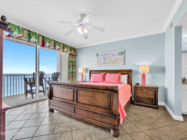 9450 S Thomas Dr Unit 1211, Panama City, FL 32408 - bedroom featuring crown molding, light tile patterned flooring, baseboards, access to exterior, and a ceiling fan