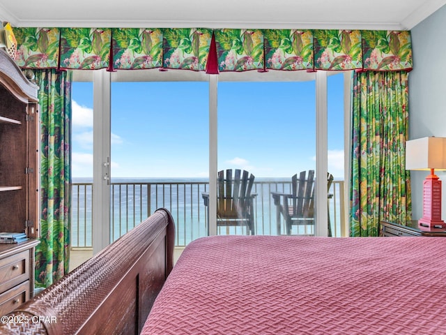 9450 S Thomas Dr Unit 1211, Panama City, FL 32408 - bedroom with ornamental molding, multiple windows, and a water view