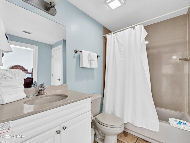 9450 S Thomas Dr Unit 1211, Panama City, FL 32408 - full bath featuring tile patterned floors, vanity, toilet, and shower / tub combo
