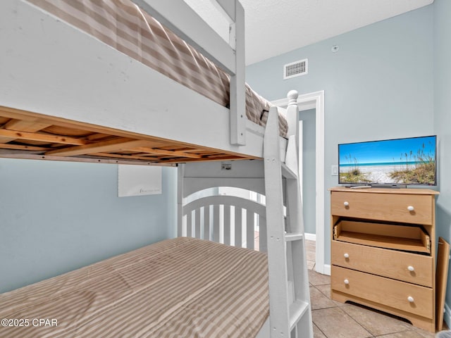 9450 S Thomas Dr Unit 1211, Panama City, FL 32408 - bedroom with tile patterned flooring