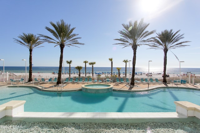 9450 S Thomas Dr Unit 1211, Panama City, FL 32408 - view of pool featuring a pool with connected hot tub and a water view