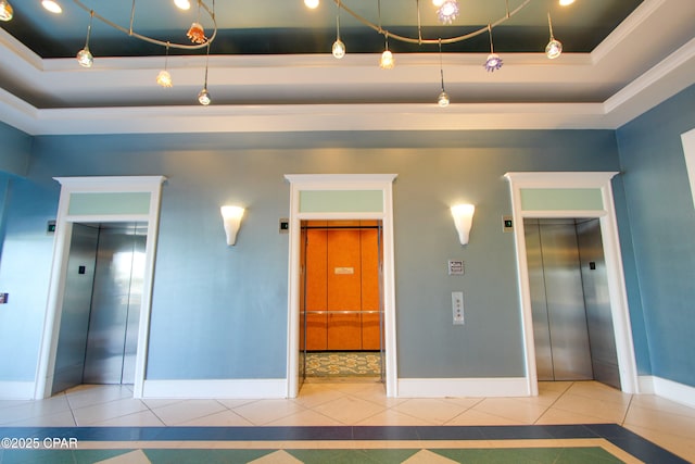 9450 S Thomas Dr Unit 1211, Panama City, FL 32408 - tiled spare room with elevator, baseboards, and a tray ceiling