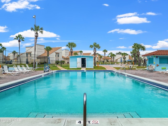 17462 Front Beach Rd, Panama City Beach, FL 32413 - community pool with a residential view, an outbuilding, and a patio