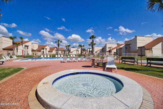 17462 Front Beach Rd, Panama City Beach, FL 32413 - community pool with a residential view, a hot tub, and a patio