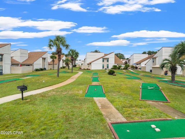 17462 Front Beach Rd, Panama City Beach, FL 32413 - view of property's community with a residential view, a lawn, and a putting green
