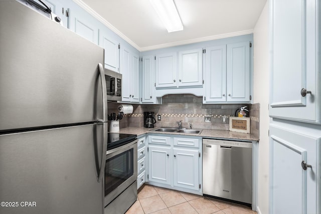 17462 Front Beach Rd, Panama City Beach, FL 32413 - kitchen featuring stainless steel appliances, a sink, tasteful backsplash, light tile patterned flooring, and light countertops