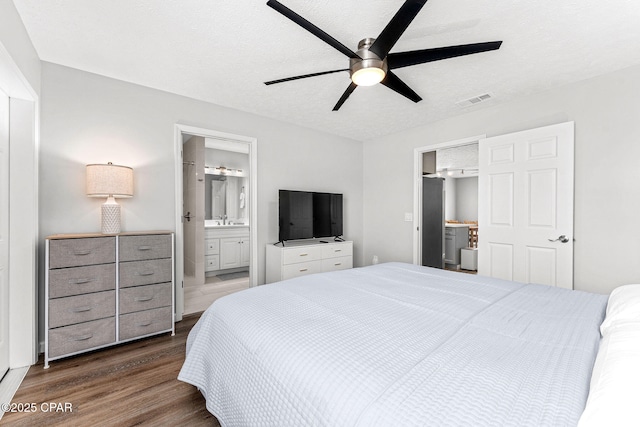 190 White Cap Way, Panama City Beach, FL 32407 - bedroom featuring dark wood-style floors, ensuite bathroom, a sink, and ceiling fan