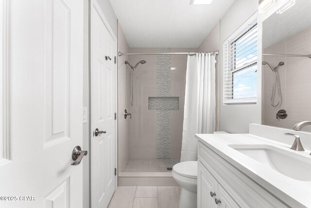 190 White Cap Way, Panama City Beach, FL 32407 - full bathroom with vanity, tiled shower, toilet, and tile patterned flooring