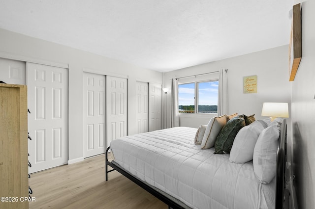23223 Front Beach Rd Unit C1-502, Panama City Beach, FL 32413 - bedroom with multiple closets and light wood-style floors