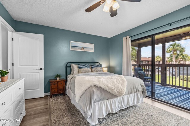 17620 Front Beach Rd Unit P2, Panama City Beach, FL 32413 - bedroom with access to outside, wood finished floors, a ceiling fan, a textured ceiling, and baseboards