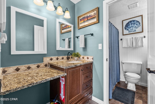 17620 Front Beach Rd Unit P2, Panama City Beach, FL 32413 - bathroom with toilet, vanity, baseboards, a textured ceiling, and a shower with curtain