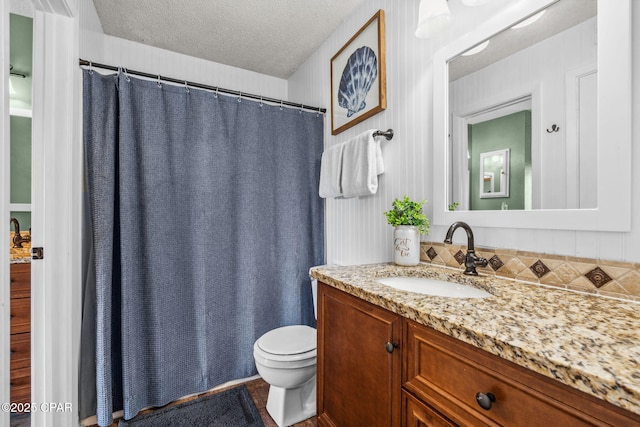 17620 Front Beach Rd Unit P2, Panama City Beach, FL 32413 - full bathroom featuring vanity, toilet, a textured ceiling, and a shower with shower curtain