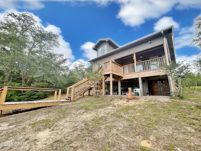 992 Hammond Lake Dr, Fountain, FL 32438 - back of house with a deck, stairway, and a ceiling fan
