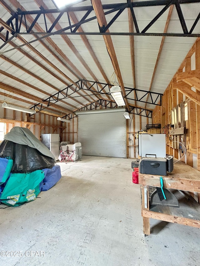 992 Hammond Lake Dr, Fountain, FL 32438 - garage featuring freestanding refrigerator
