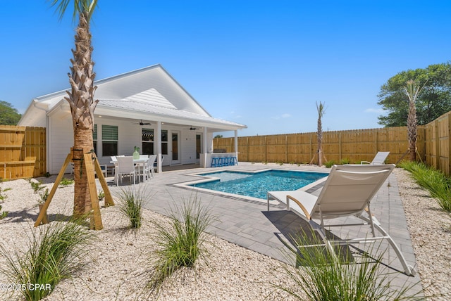 309 Tanaga St, Panama City Beach, FL 32413 - view of swimming pool with ceiling fan, a fenced backyard, a patio area, and outdoor dining area