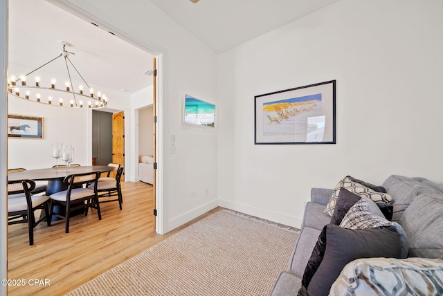 309 Tanaga St, Panama City Beach, FL 32413 - living area with a chandelier and light wood-type flooring