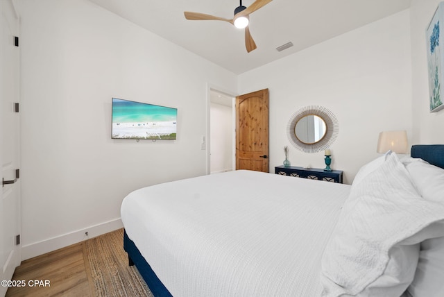 309 Tanaga St, Panama City Beach, FL 32413 - bedroom featuring wood finished floors and a ceiling fan
