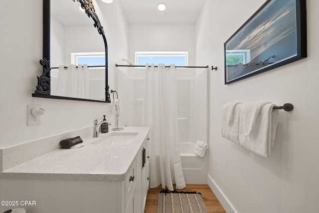 309 Tanaga St, Panama City Beach, FL 32413 - full bath featuring wood finished floors, shower / tub combo, and vanity
