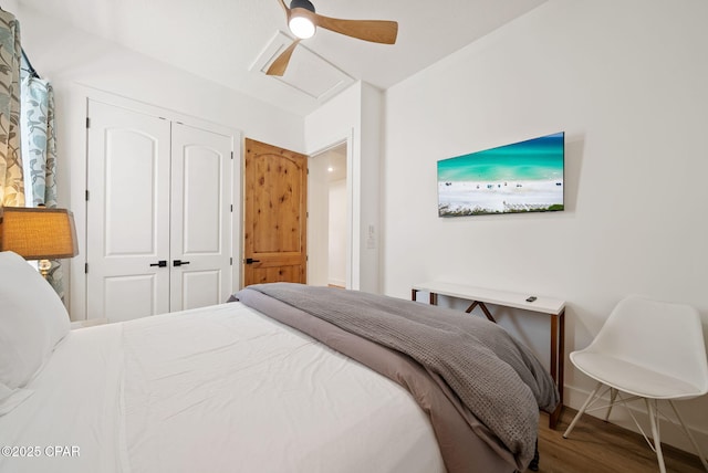 309 Tanaga St, Panama City Beach, FL 32413 - bedroom featuring wood finished floors, a closet, a ceiling fan, and attic access