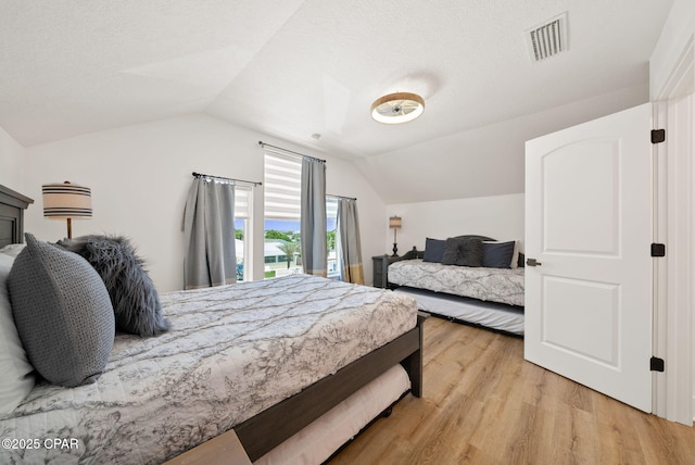 309 Tanaga St, Panama City Beach, FL 32413 - bedroom with vaulted ceiling and light wood finished floors