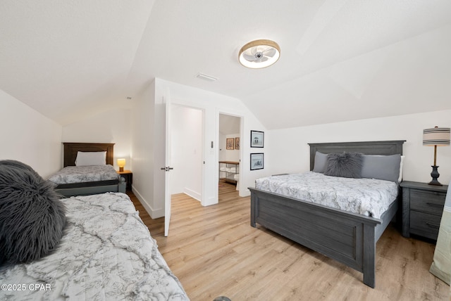 309 Tanaga St, Panama City Beach, FL 32413 - bedroom with lofted ceiling and light wood-style floors