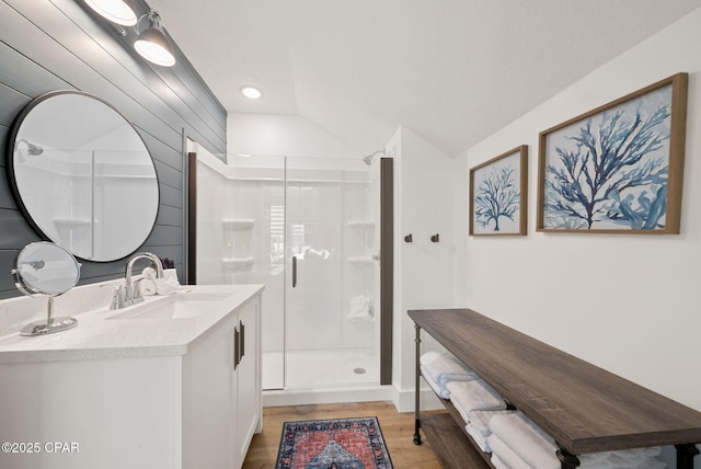 309 Tanaga St, Panama City Beach, FL 32413 - full bath with a shower stall, vanity, wood finished floors, lofted ceiling, and recessed lighting