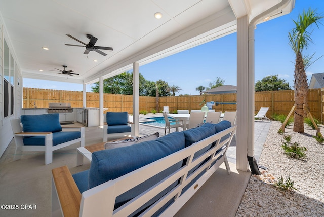 309 Tanaga St, Panama City Beach, FL 32413 - fenced backyard featuring an outdoor living space, an outdoor kitchen, a patio area, and ceiling fan