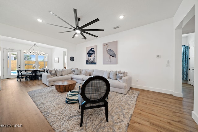 309 Tanaga St, Panama City Beach, FL 32413 - living room with light wood finished floors, a chandelier, a ceiling fan, and recessed lighting