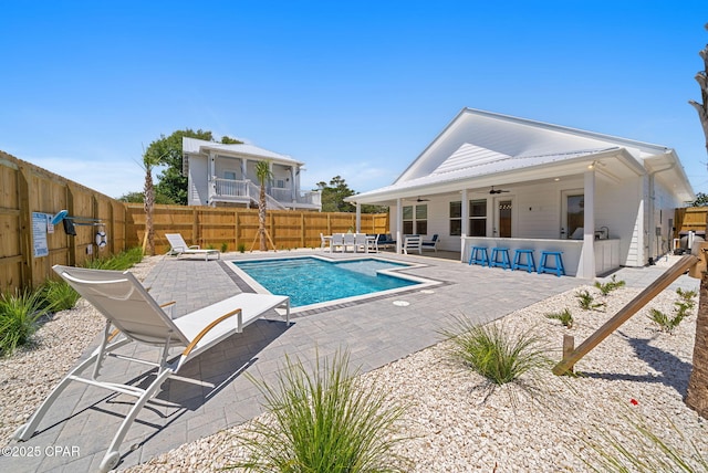 309 Tanaga St, Panama City Beach, FL 32413 - view of swimming pool with a ceiling fan, a fenced backyard, and a patio area