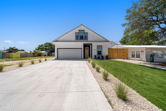 309 Tanaga St, Panama City Beach, FL 32413 - view of front of house with driveway and a garage