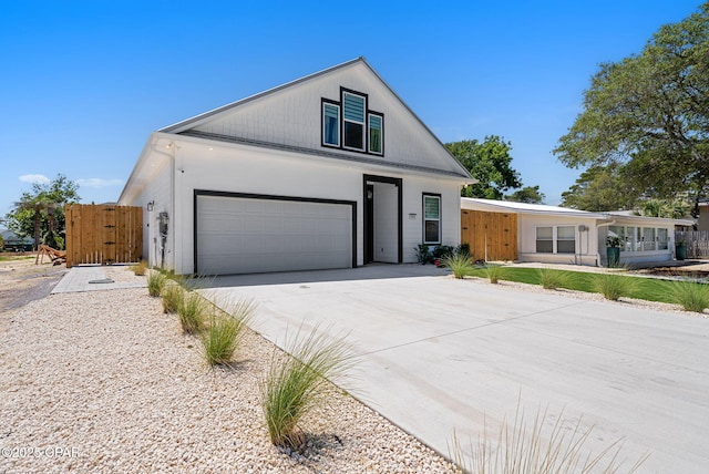 309 Tanaga St, Panama City Beach, FL 32413 - view of front facade featuring a garage and driveway