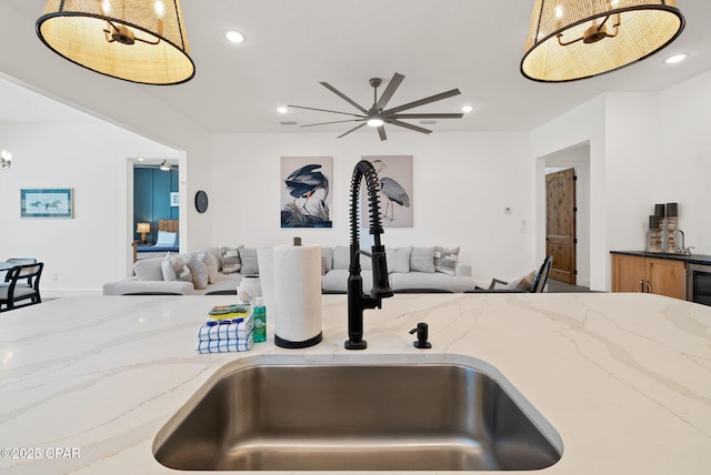 309 Tanaga St, Panama City Beach, FL 32413 - kitchen with open floor plan, light stone counters, recessed lighting, decorative light fixtures, and ceiling fan