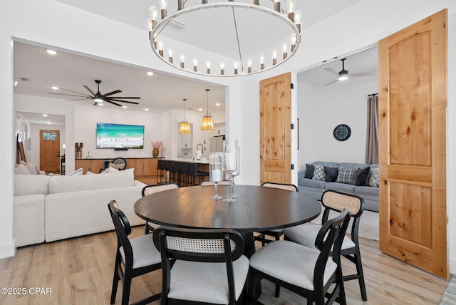 309 Tanaga St, Panama City Beach, FL 32413 - dining area with ceiling fan, light wood-style flooring, and recessed lighting