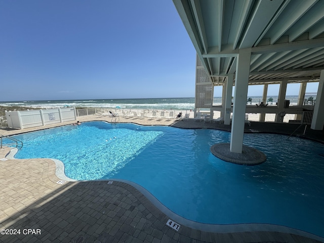 14401 Front Beach Rd Unit 221, Panama City Beach, FL 32413 - community pool with a water view and a patio