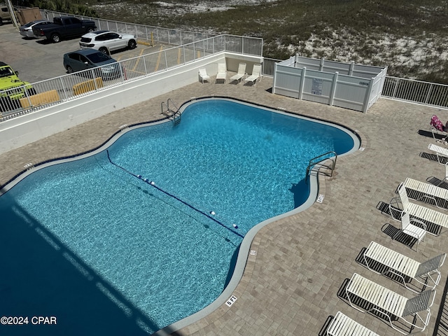 14401 Front Beach Rd Unit 221, Panama City Beach, FL 32413 - community pool featuring a patio area