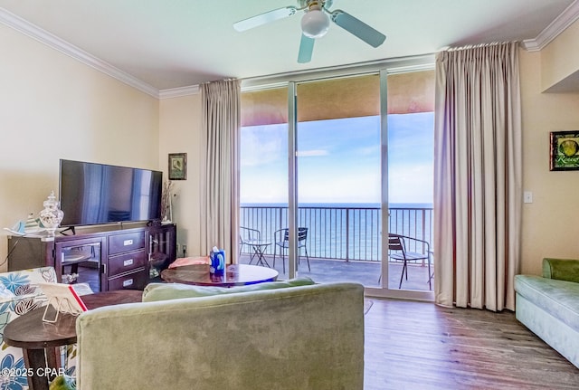 16819 Front Beach Rd Unit 2910, Panama City Beach, FL 32413 - living area with wood finished floors, ornamental molding, ceiling fan, expansive windows, and a water view