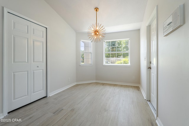 101 Loblolly Ct, Panama City Beach, FL 32413 - unfurnished dining area with a chandelier, light wood-style floors, and baseboards