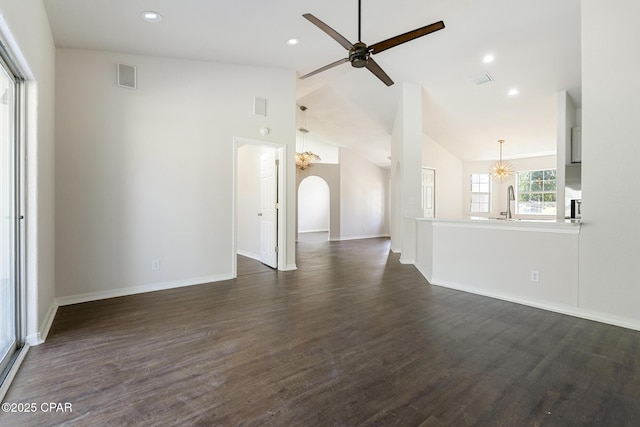 101 Loblolly Ct, Panama City Beach, FL 32413 - unfurnished living room with baseboards, dark wood-style flooring, ceiling fan, recessed lighting, and arched walkways
