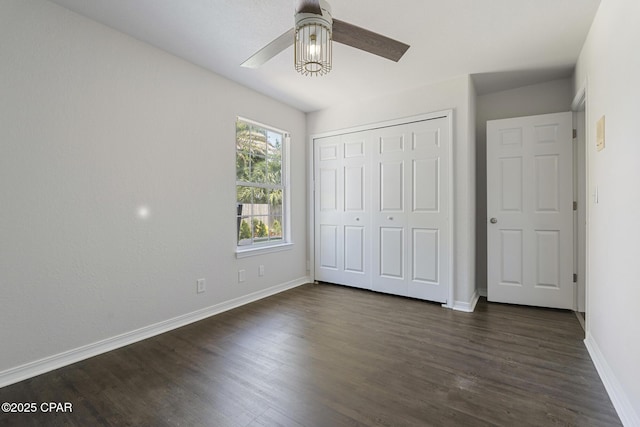 101 Loblolly Ct, Panama City Beach, FL 32413 - unfurnished bedroom featuring baseboards, dark wood finished floors, a closet, and ceiling fan