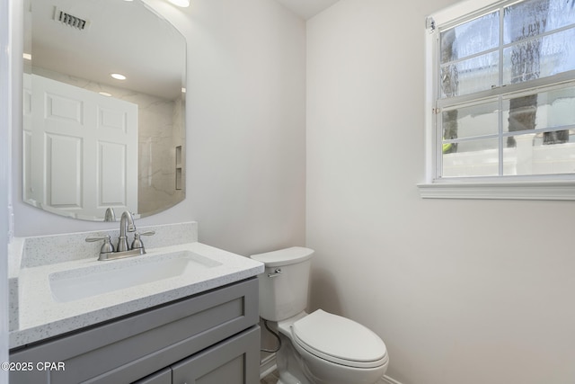 101 Loblolly Ct, Panama City Beach, FL 32413 - bathroom featuring toilet, vanity, and baseboards
