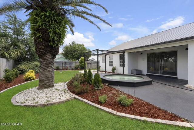 101 Loblolly Ct, Panama City Beach, FL 32413 - view of yard featuring an in-ground hot tub and a patio