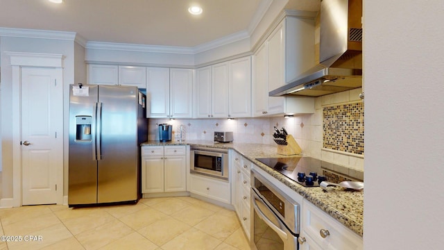 11807 Front Beach Rd Unit 2204, Panama City Beach, FL 32407 - kitchen with appliances with stainless steel finishes, wall chimney range hood, decorative backsplash, light stone countertops, and ornamental molding
