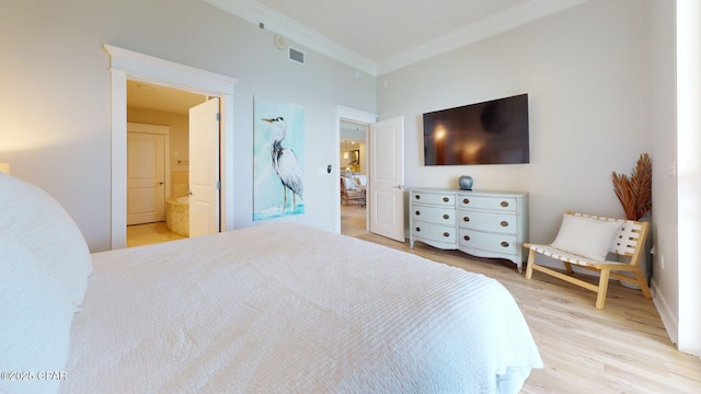 11807 Front Beach Rd Unit 2204, Panama City Beach, FL 32407 - bedroom with ornamental molding, light wood-style flooring, and connected bathroom