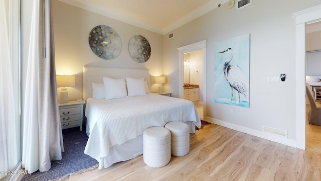 11807 Front Beach Rd Unit 2204, Panama City Beach, FL 32407 - bedroom with ornamental molding, wood finished floors, ensuite bathroom, and baseboards