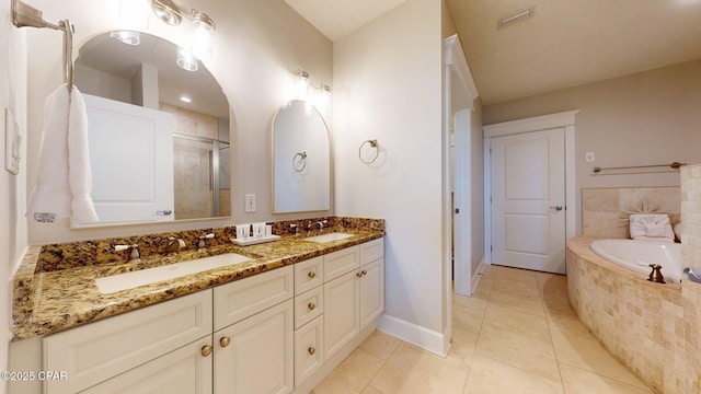 11807 Front Beach Rd Unit 2204, Panama City Beach, FL 32407 - bathroom featuring double vanity, a bath, baseboards, an enclosed shower, and tile patterned floors
