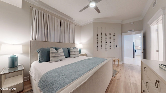 11807 Front Beach Rd Unit 2204, Panama City Beach, FL 32407 - bedroom with crown molding, light wood-type flooring, baseboards, and a ceiling fan